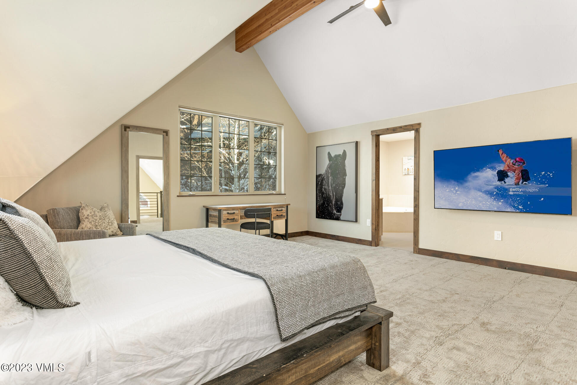 160 Nottingham Road, Unit 1 Avon, CO 81620 - Photo 22 of 28 a bedroom with a large bed and a painting on the wall