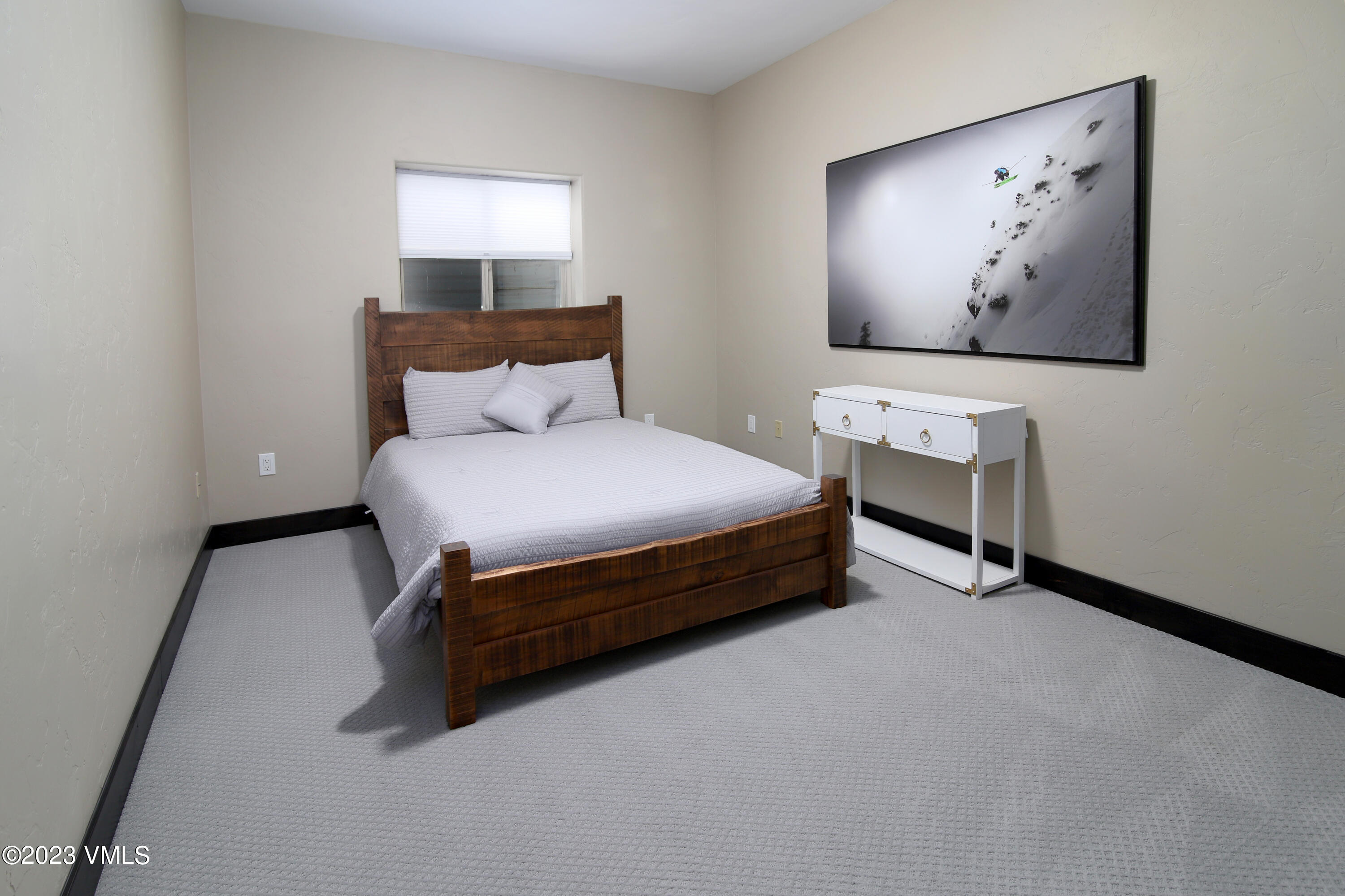 160 Nottingham Road, Unit 1 Avon, CO 81620 - Photo 23 of 28 a bedroom with a bed and wall painting