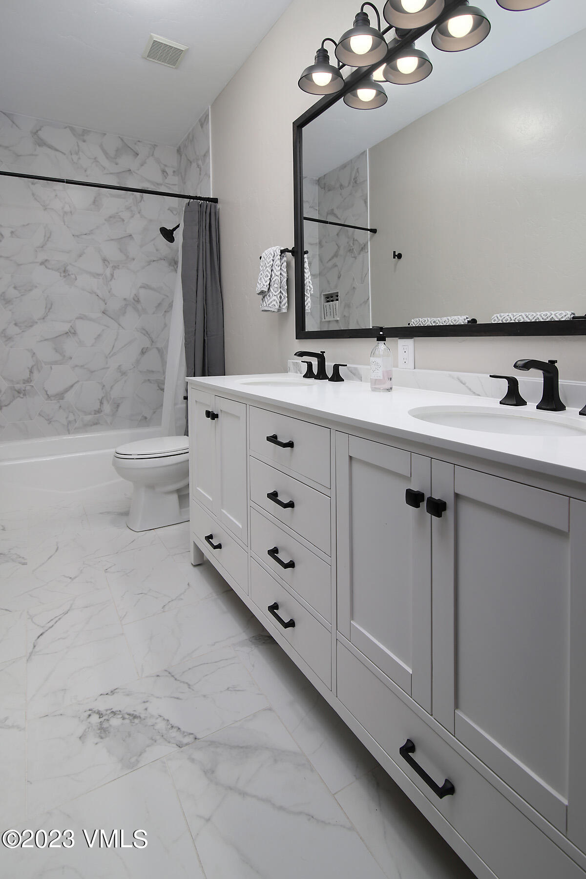 160 Nottingham Road, Unit 1 Avon, CO 81620 - Photo 25 of 28 a bathroom with a sink a toilet and mirror