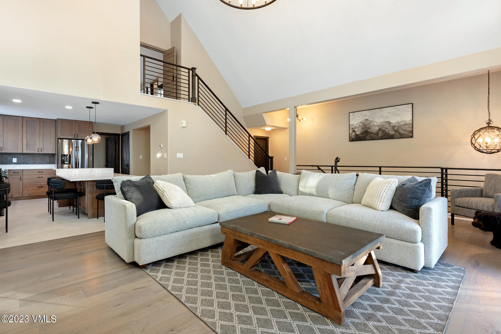 160 Nottingham Road, Unit 1 Avon, CO 81620 - Photo 7 of 28 a living room with furniture a rug and a chandelier