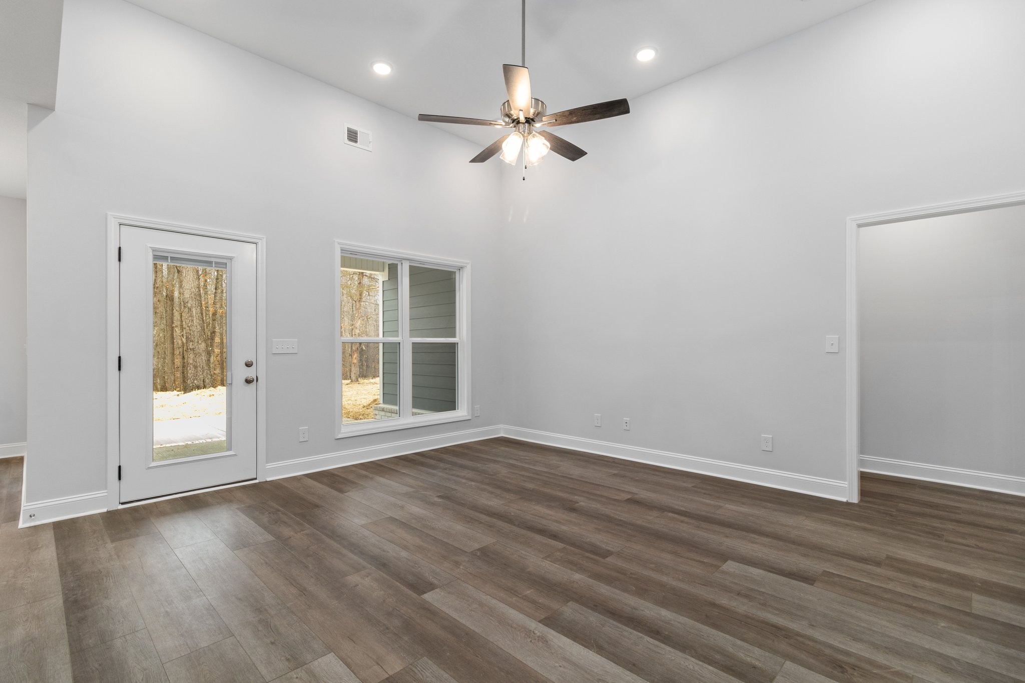 490 Ridge Top Court Clarksville, TN 37040 - Photo 5 of 7 a view of an empty room with wooden floor and a window