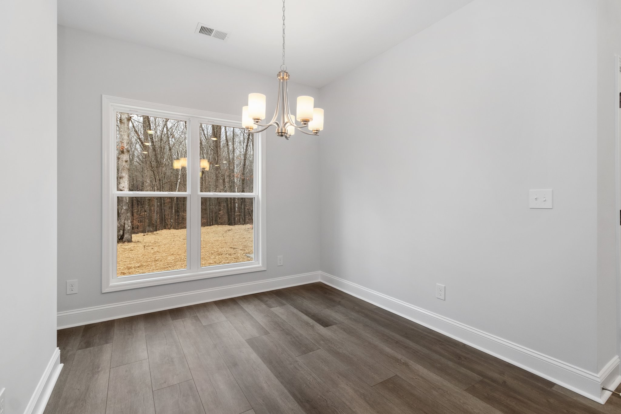 490 Ridge Top Court Clarksville, TN 37040 - Photo 6 of 7 an empty room with wooden floor and door