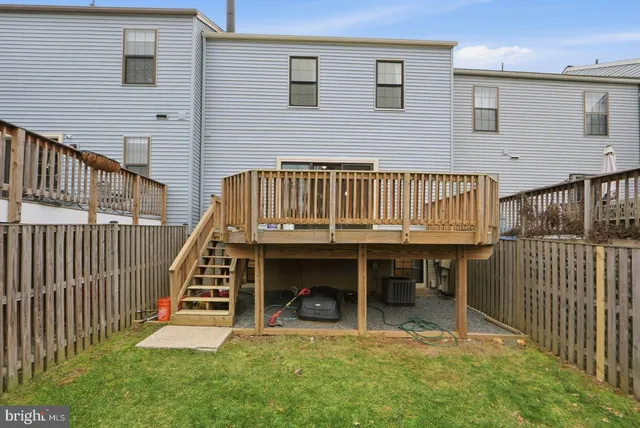 a view of a house with wooden deck