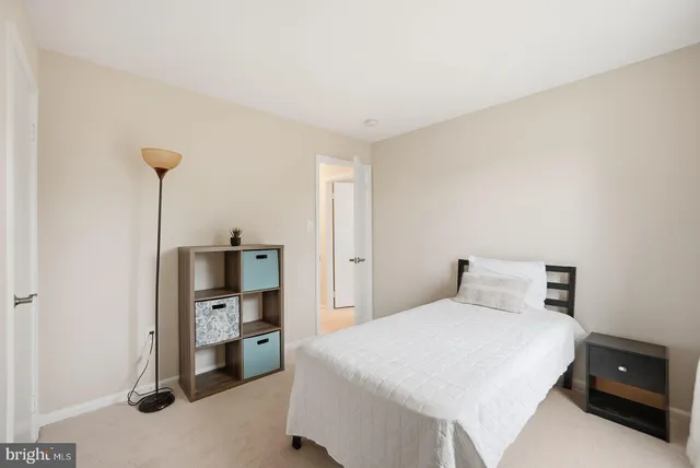 a bedroom with a bed and a tv