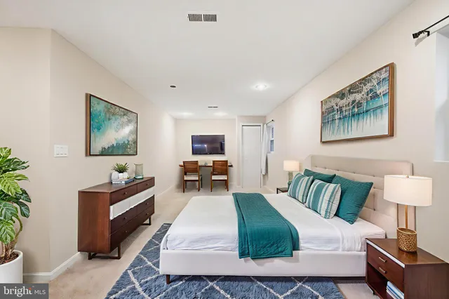 a bedroom with a bed and lamp