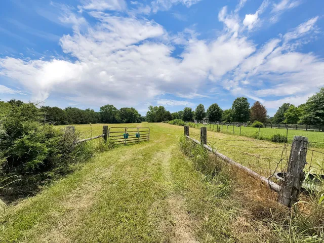 a view of a lake with a big yard