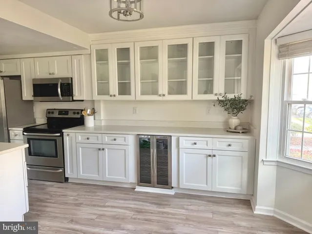 a kitchen with stainless steel appliances granite countertop a stove and a sink