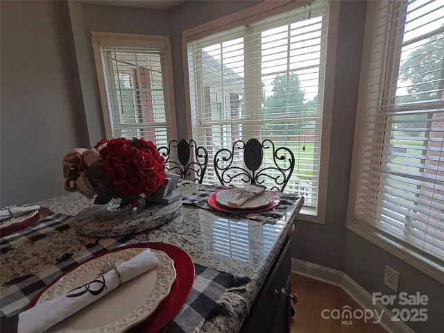 a room with furniture and large windows