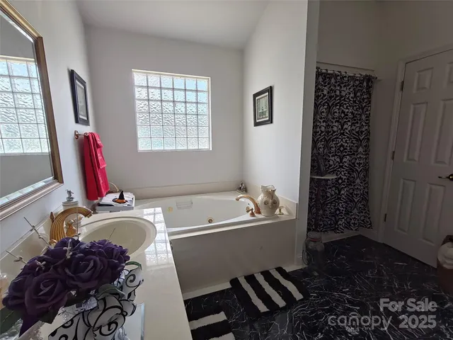 a room with a couch a rug and a window