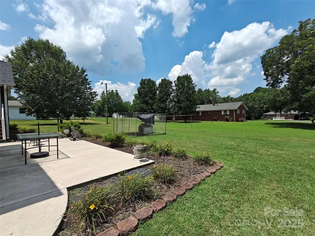 a view of a garden with sitting area