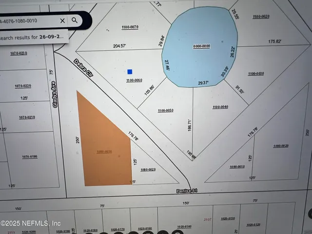 a view of backyard space and trees