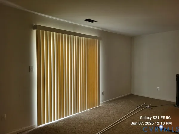 a view of a room with a large window