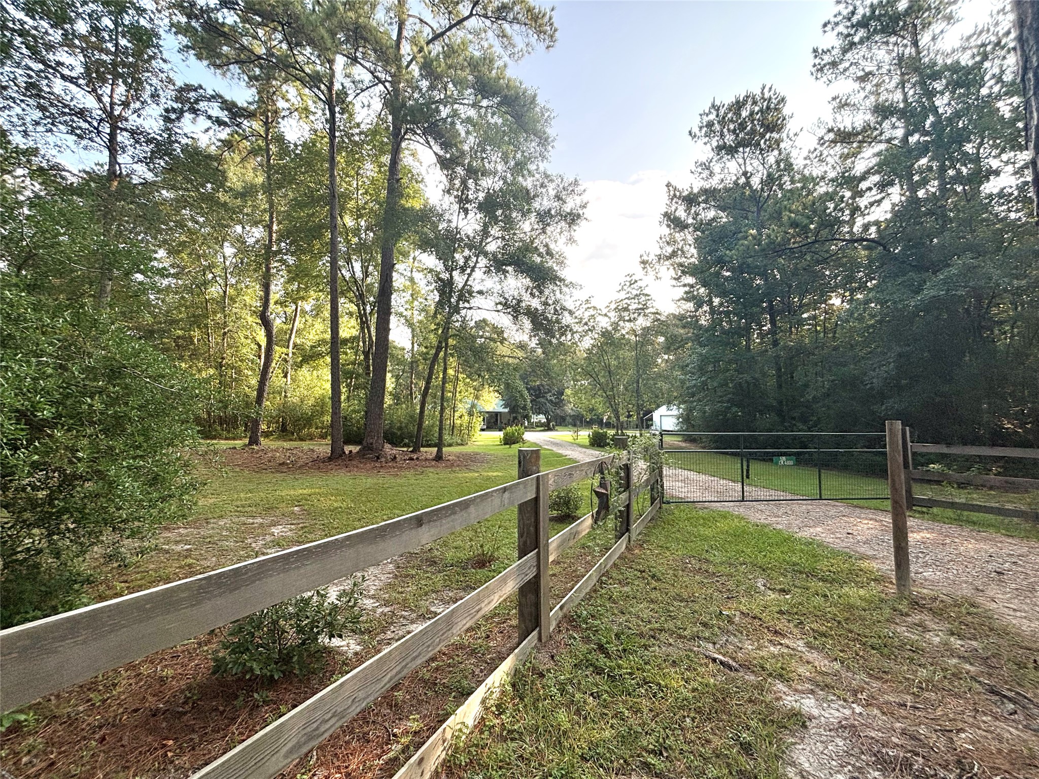 516 County Road 4800 Warren, TX 77664 - Photo 2 of 50 a view of a backyard with wooden fence