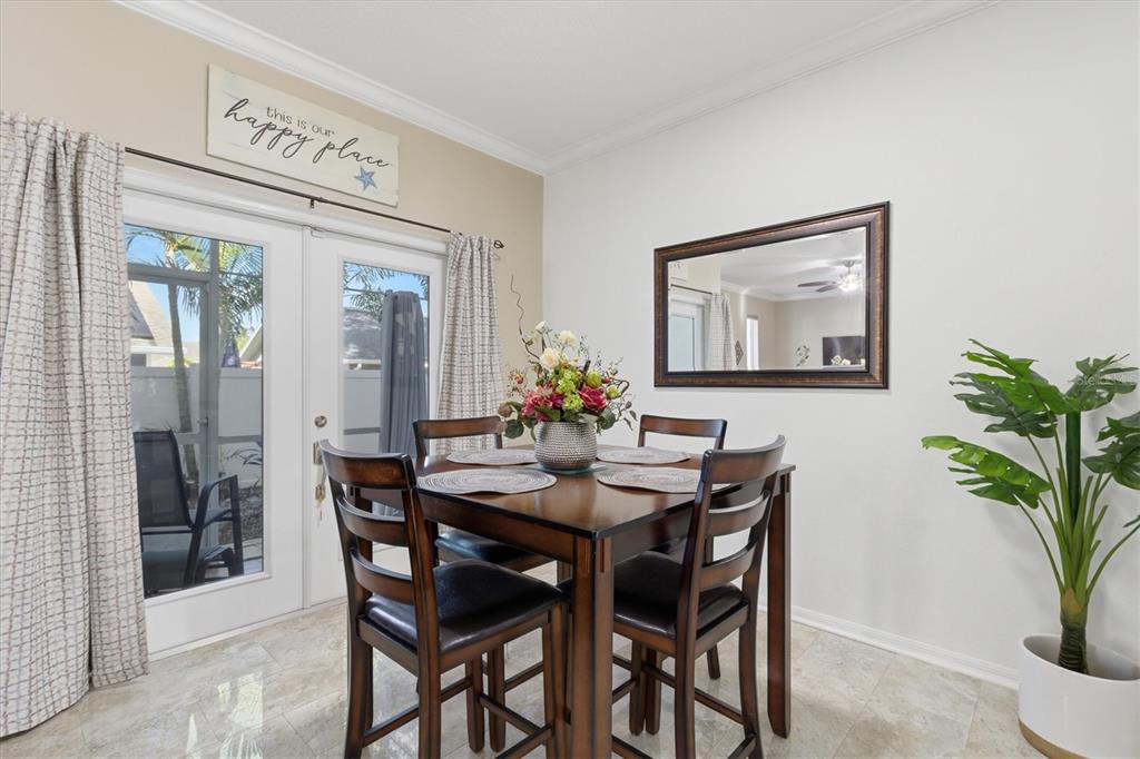 3221 Meta Court Largo, FL 33771 - Photo 12 of 40 a dining room with furniture and wooden floor