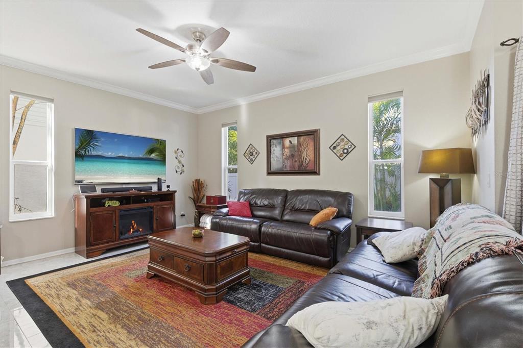 3221 Meta Court Largo, FL 33771 - Photo 14 of 40 a living room with furniture and a flat screen tv