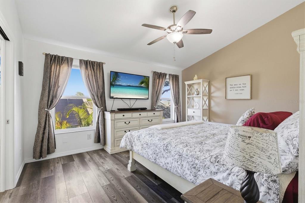 3221 Meta Court Largo, FL 33771 - Photo 18 of 40 a bedroom with a bed and a flat screen tv