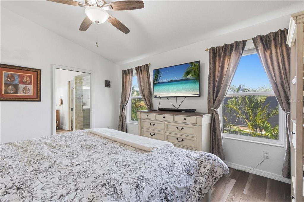 3221 Meta Court Largo, FL 33771 - Photo 19 of 40 a bedroom with a bed and a flat screen tv