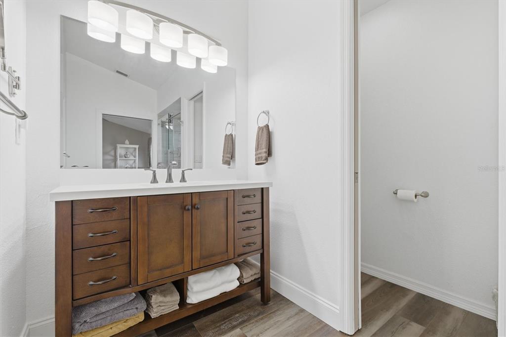 3221 Meta Court Largo, FL 33771 - Photo 23 of 40 a spacious bathroom with a double vanity sink and a mirror