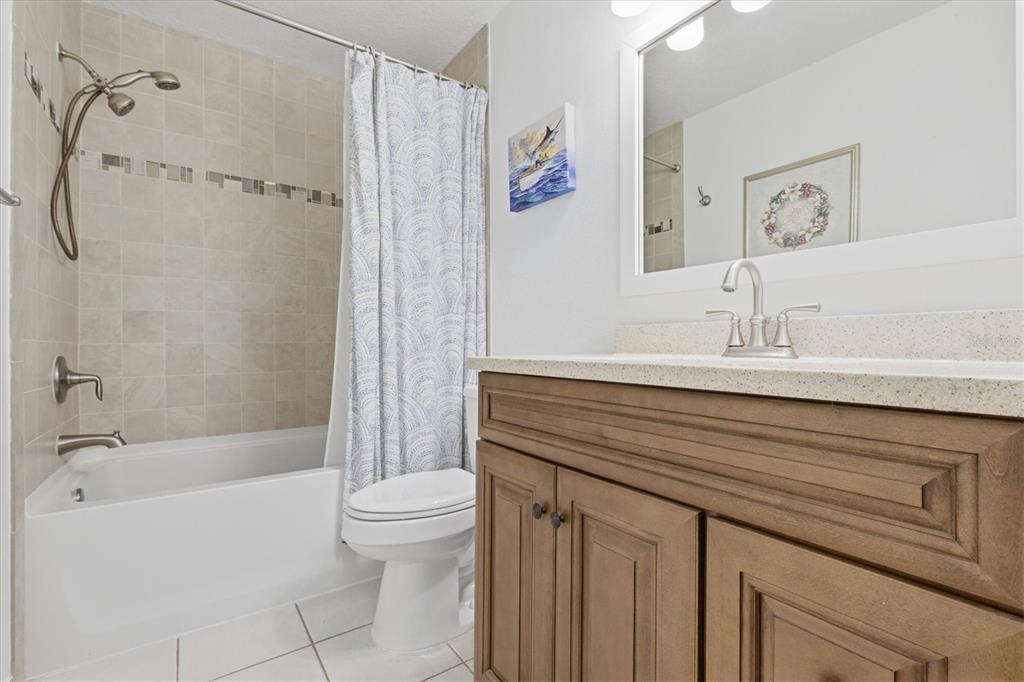 3221 Meta Court Largo, FL 33771 - Photo 26 of 40 a bathroom with a sink a toilet and a bathtub