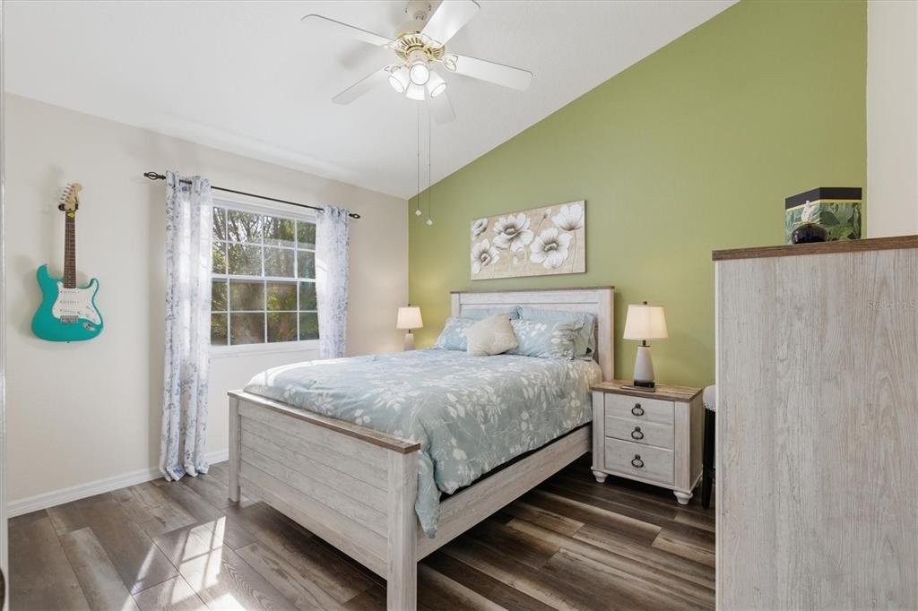 3221 Meta Court Largo, FL 33771 - Photo 27 of 40 a bedroom with a bed dresser and a window
