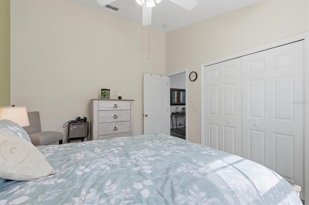 3221 Meta Court Largo, FL 33771 - Photo 28 of 40 a large bedroom with a bed and a cabinets