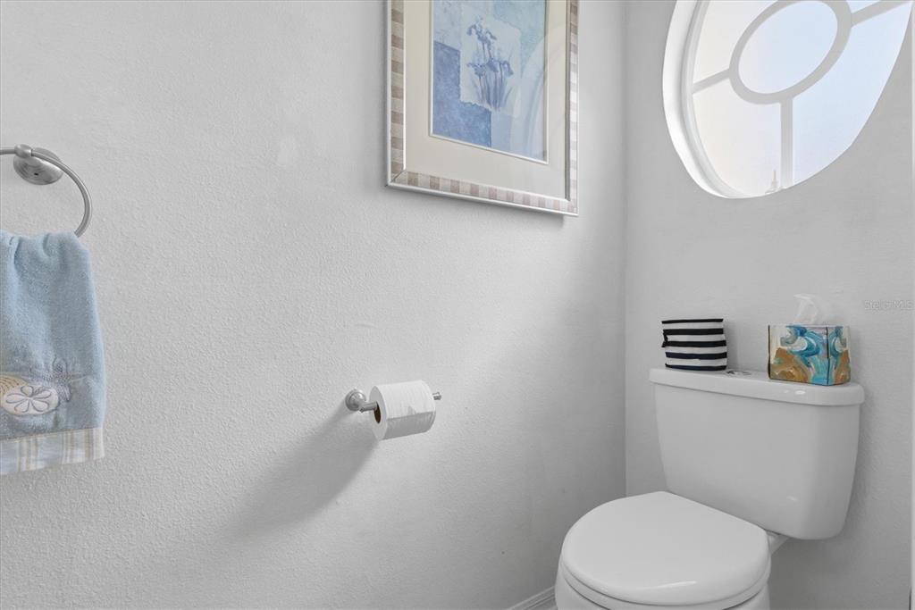 3221 Meta Court Largo, FL 33771 - Photo 30 of 40 a white toilet sitting next to a bathroom sink