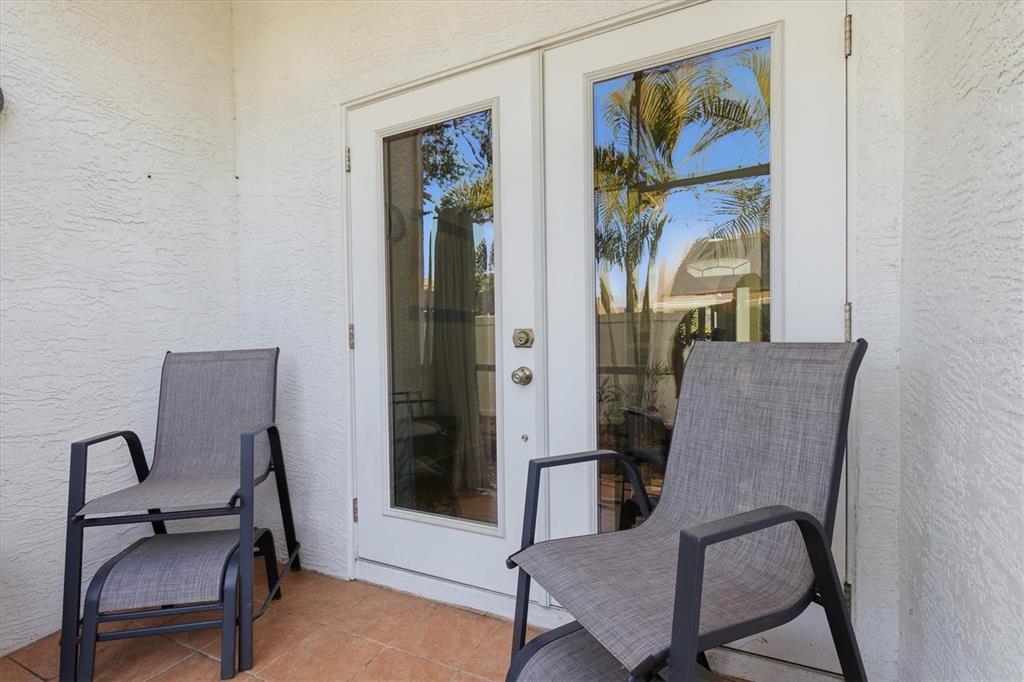 3221 Meta Court Largo, FL 33771 - Photo 32 of 40 a view of a hallway with furniture and a potted plant
