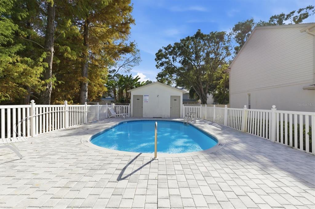 3221 Meta Court Largo, FL 33771 - Photo 36 of 40 a backyard of a house with table and chairs