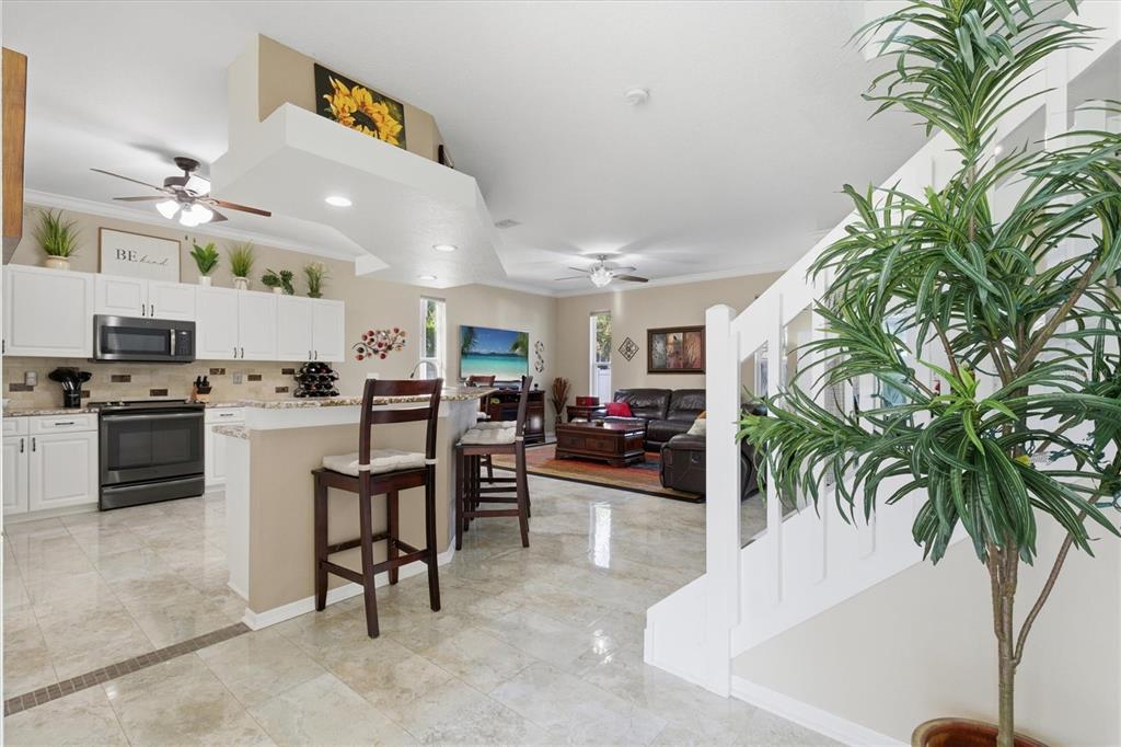 3221 Meta Court Largo, FL 33771 - Photo 6 of 40 a kitchen with a table and chairs in it