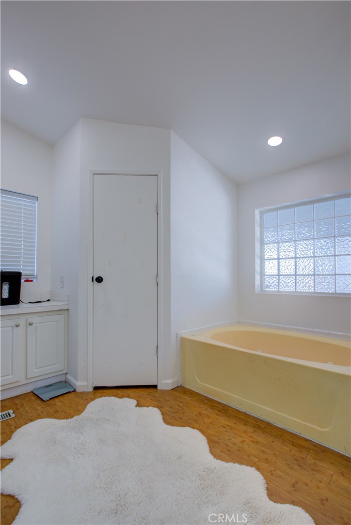 6450 North Winton Way, Unit 76 Winton, CA 95388 - Photo 11 of 38 a view of a room with wooden floor and cabinet
