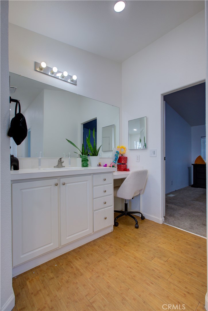 6450 North Winton Way, Unit 76 Winton, CA 95388 - Photo 12 of 38 a bedroom with a bed and a chandelier