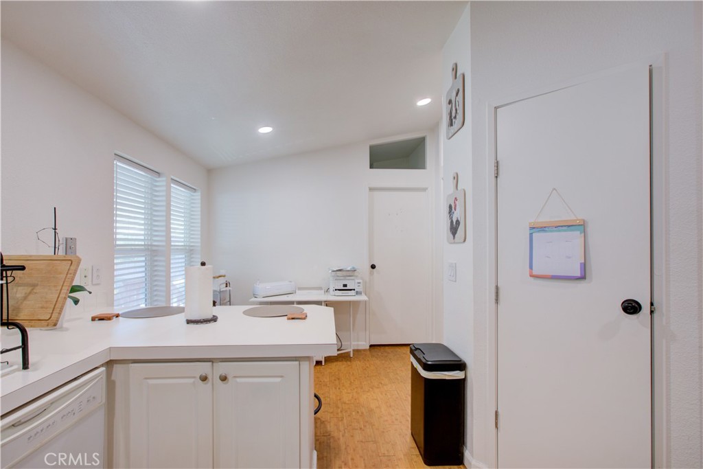 6450 North Winton Way, Unit 76 Winton, CA 95388 - Photo 17 of 38 a kitchen with a sink and a refrigerator
