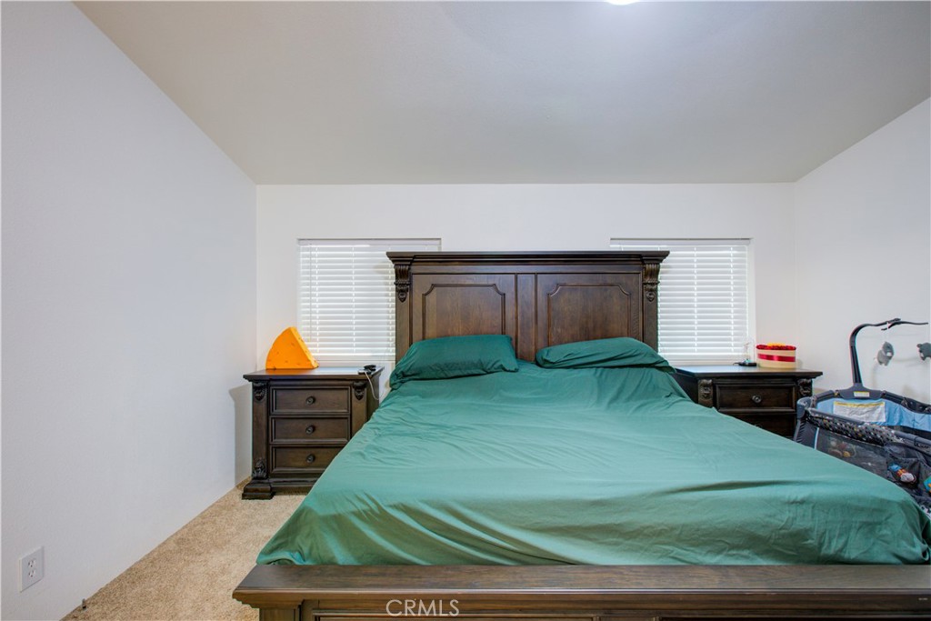 6450 North Winton Way, Unit 76 Winton, CA 95388 - Photo 9 of 38 a view of a room with a fireplace and a window