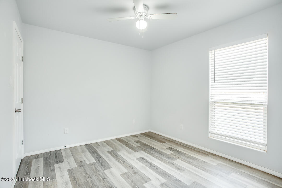 5514 Jarvis Street Lubbock, TX 79416 - Photo 14 of 16 an empty room with a window
