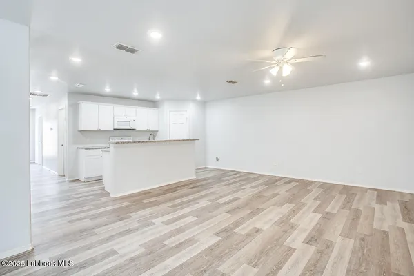 a view of kitchen with wooden floor