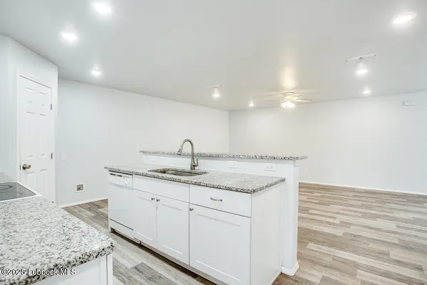a kitchen with a sink and cabinets