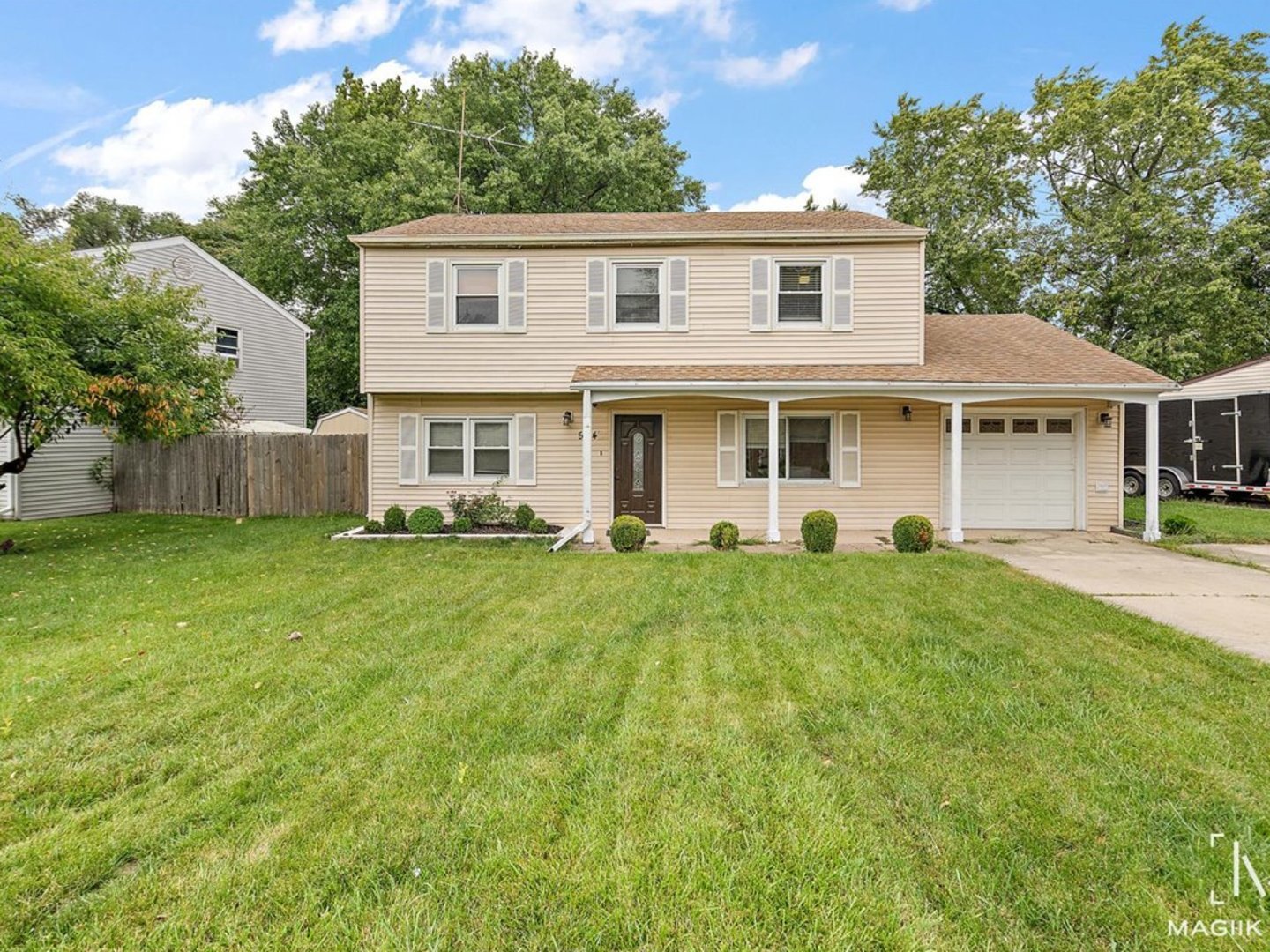 554 Redwood Road Bolingbrook, IL 60440 - Photo 1 of 1 a front view of a house with a yard and trees