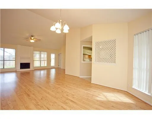 a view interior of a house with wooden floor windows and a chandelier