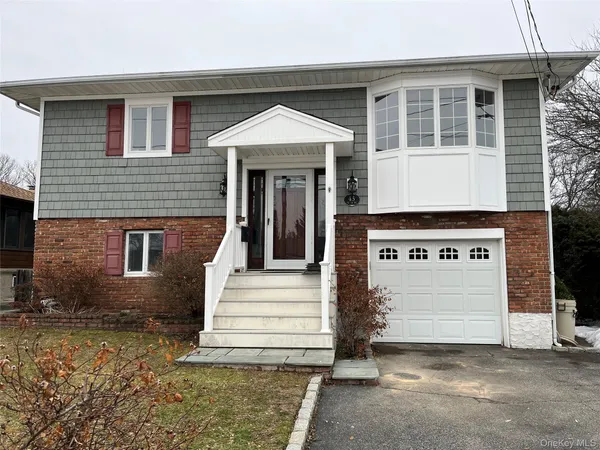 a front view of a house with a garage
