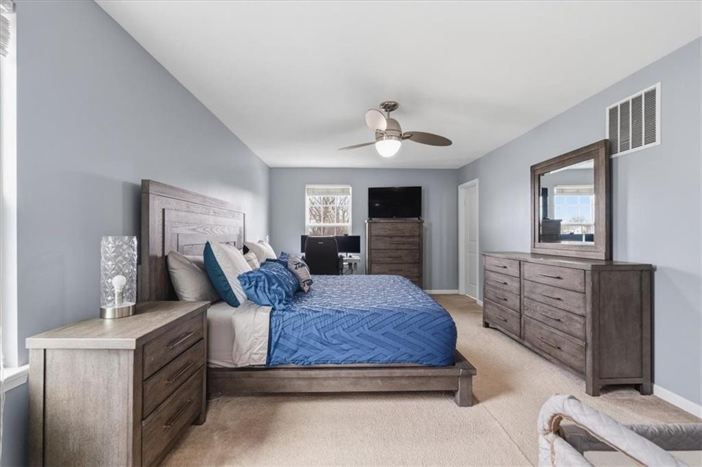 235 Long Ridge Drive Coraopolis, PA 15108 - Photo 17 of 36 a bedroom with a large bed a flat tv screen and dresser