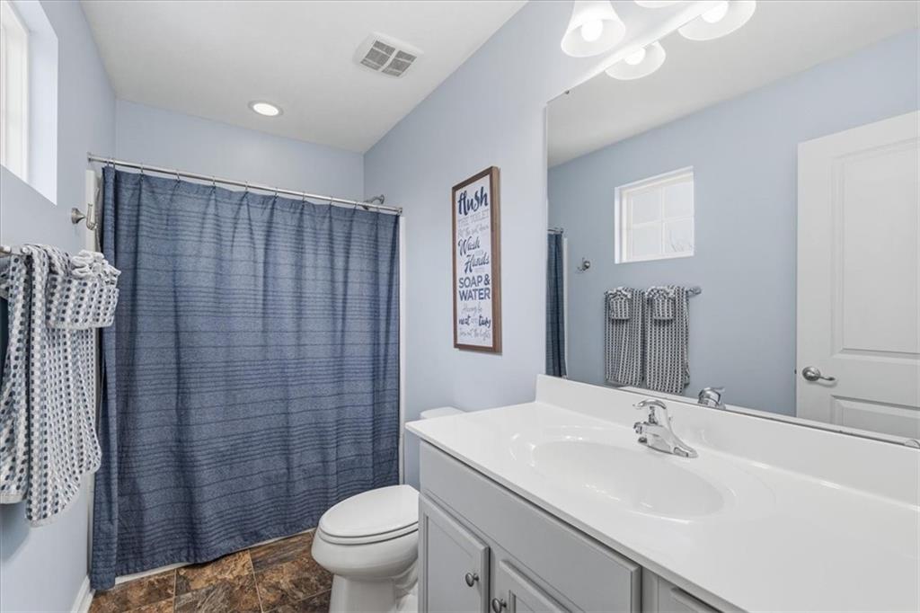 235 Long Ridge Drive Coraopolis, PA 15108 - Photo 19 of 36 a bathroom with a sink a toilet a mirror a vanity and shower