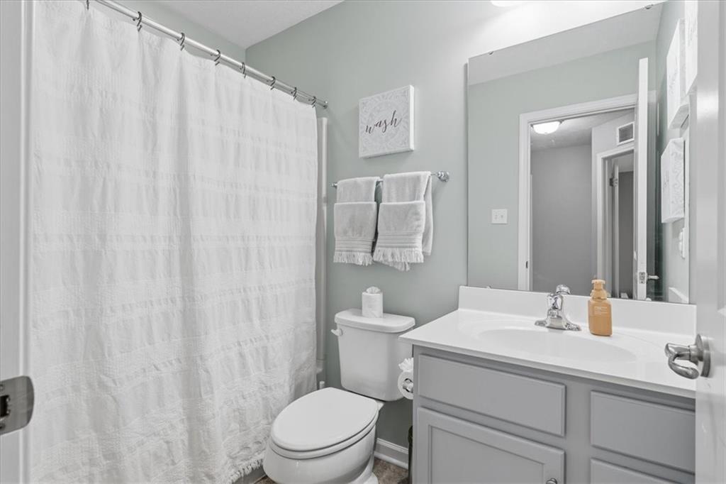 235 Long Ridge Drive Coraopolis, PA 15108 - Photo 22 of 36 a bathroom with a sink a toilet and shower curtain