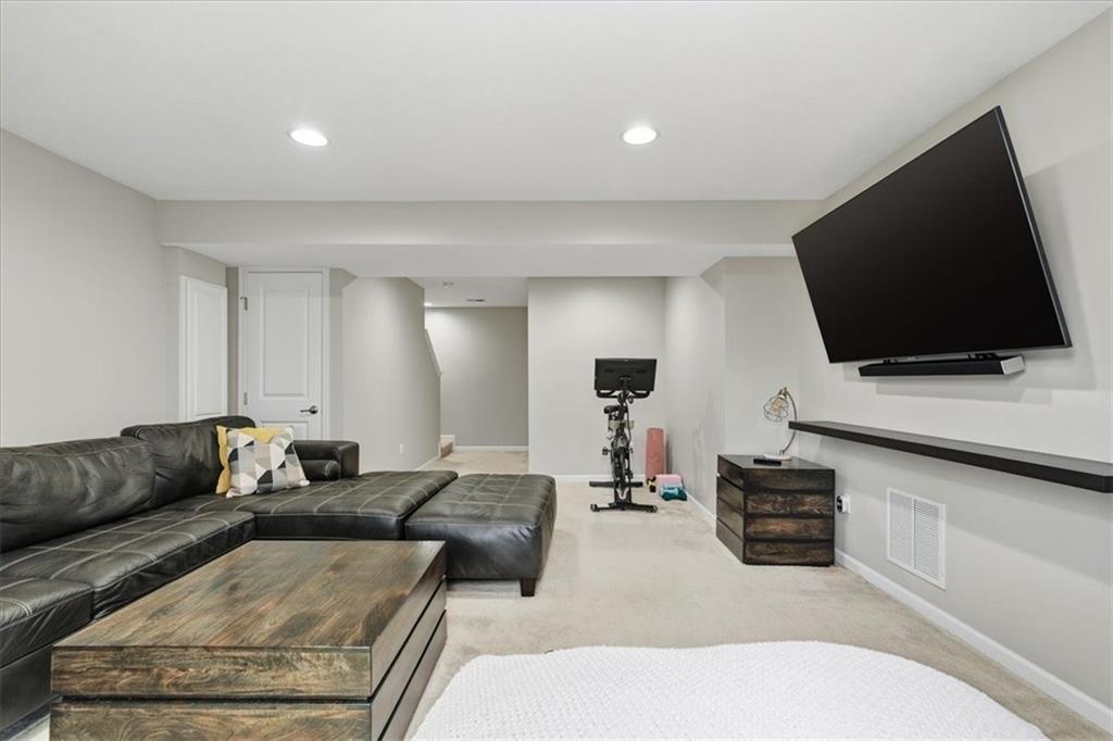 235 Long Ridge Drive Coraopolis, PA 15108 - Photo 25 of 36 a living room with furniture and a flat screen tv