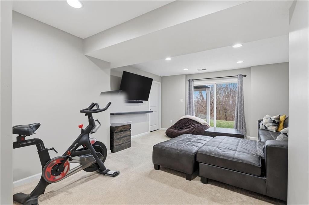 235 Long Ridge Drive Coraopolis, PA 15108 - Photo 26 of 36 a bedroom with furniture a flat screen tv and a window