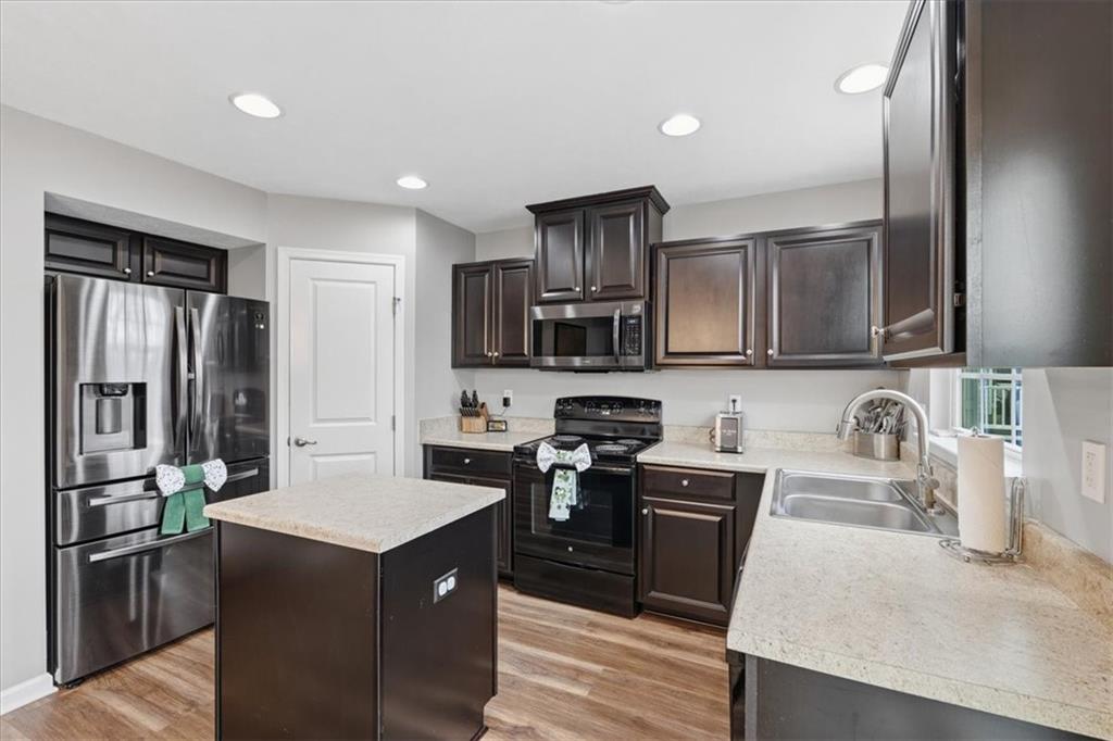 235 Long Ridge Drive Coraopolis, PA 15108 - Photo 10 of 36 a kitchen with stainless steel appliances granite countertop a sink stove and refrigerator