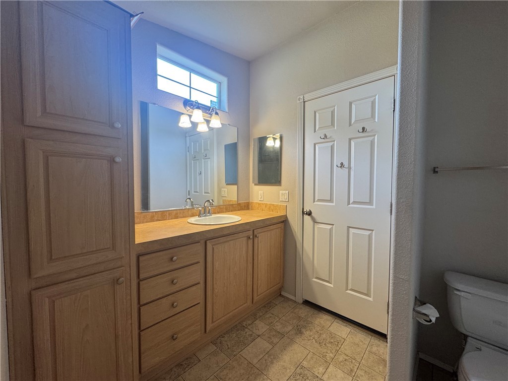 10044 Kent Road Mohave Valley, AZ 86440 - Photo 20 of 25 Bathroom featuring vanity and stone finish flooring