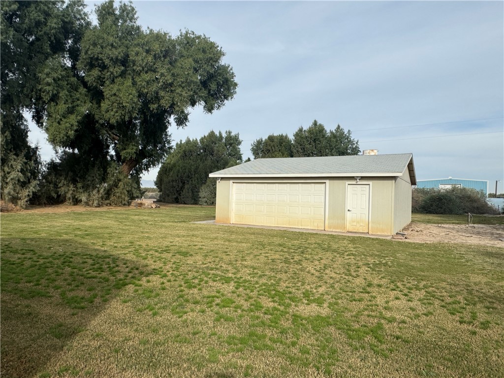 10044 Kent Road Mohave Valley, AZ 86440 - Photo 22 of 25 View of grassy yard with an outbuilding