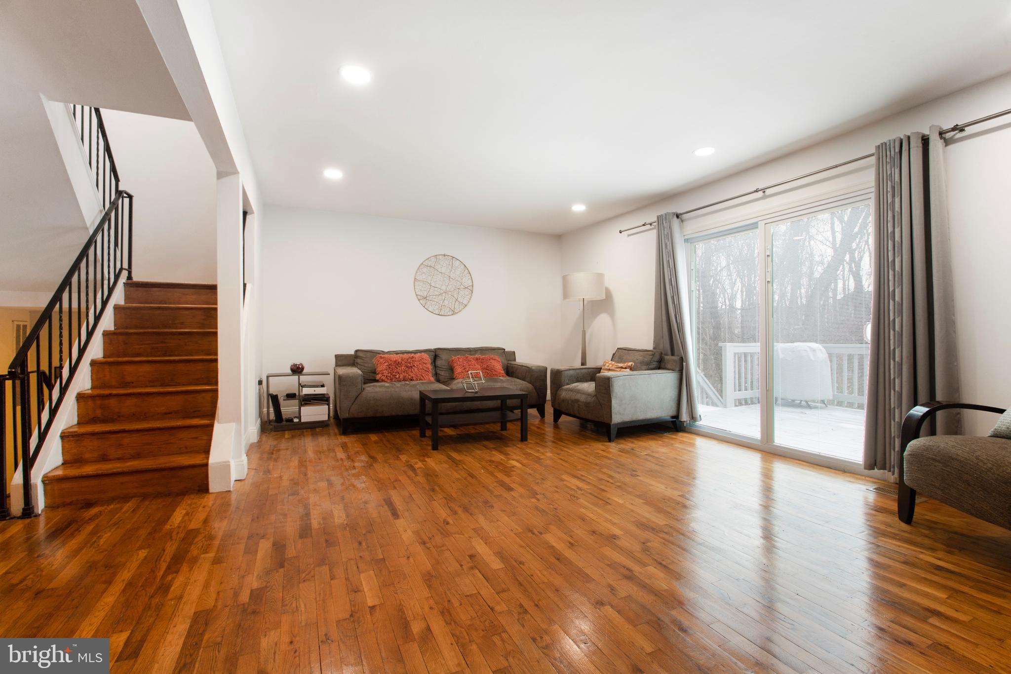8253 Vosges Road Baltimore, MD 21208 - Photo 19 of 67 Family Room With Glimpse to Outside Deck Area