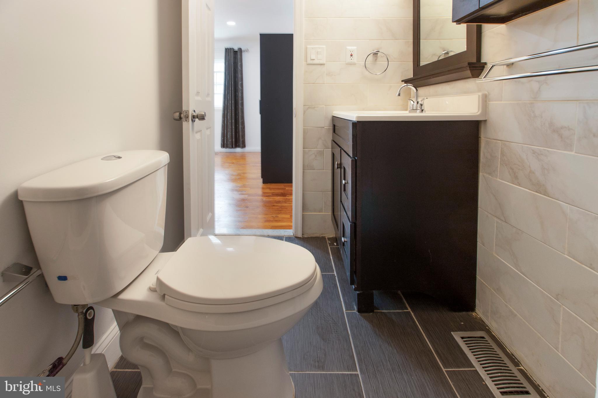 8253 Vosges Road Baltimore, MD 21208 - Photo 34 of 67 Owners En-Suite All Modern Flooring