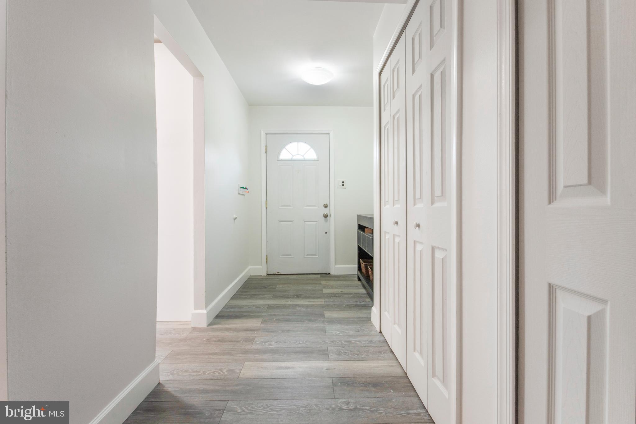8253 Vosges Road Baltimore, MD 21208 - Photo 4 of 67 Foyer With All New Modern Flooring